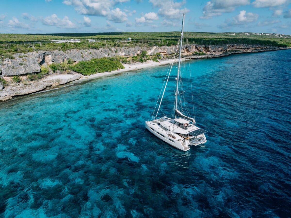 Private catamaran anchored near a secluded beach in Bonaire