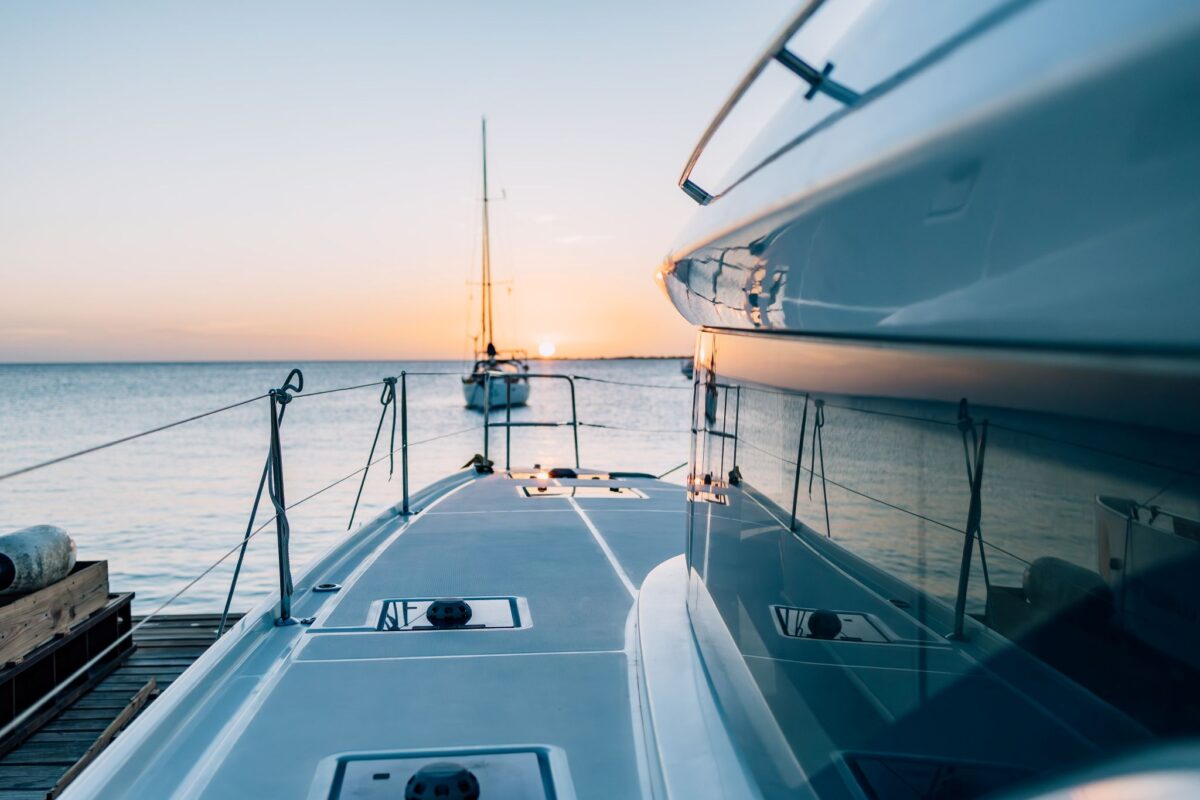 View from the bow of a private catamaran at sunset in Bonaire