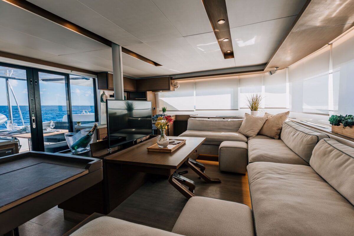 Salon interior aboard a private catamaran charter with sea view